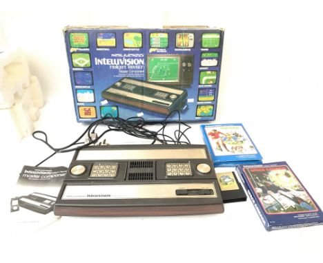 A Mattel Electronics Intellivision intelligent system with three games.