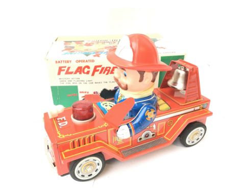 A Boxed Tinplate Battery Operated Flag Fire Engine by Masudaya of Japan.