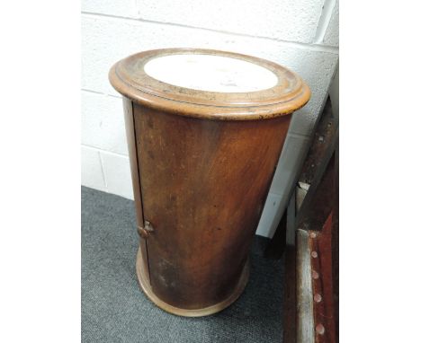 A 19th century mahogany cylindrical commode/night stand having inset marble top