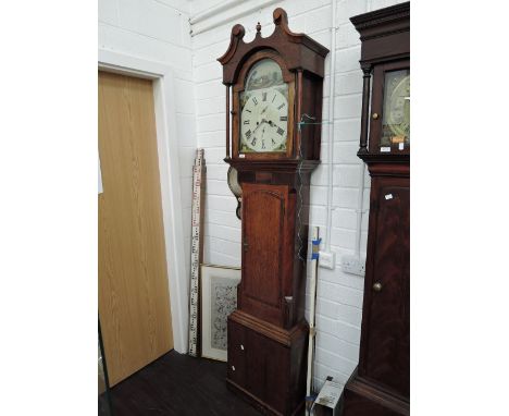 A late 18th century oak longcase clock having swan neck and pillar hood containing painted arch decoration and 8 day movement