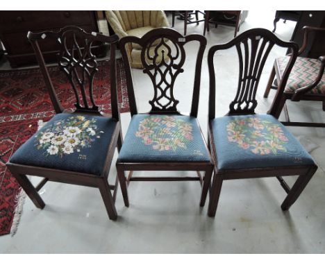Three early 19th century mahogany standard dining chairs, two with scroll backs, one with slat back having later (1999 and 20