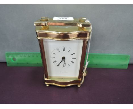 A late 20th century brass carriage clock in the French style, by H Samuel