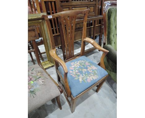 An early 20th century elm and fruit wood vernacular carver dining chair having slat back with later tapestry seat and square 