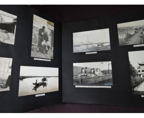 A vintage photograph album containing monochrome images of Japan and China