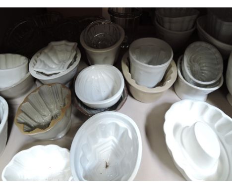 A selection of vintage pottery and glass jelly moulds, various