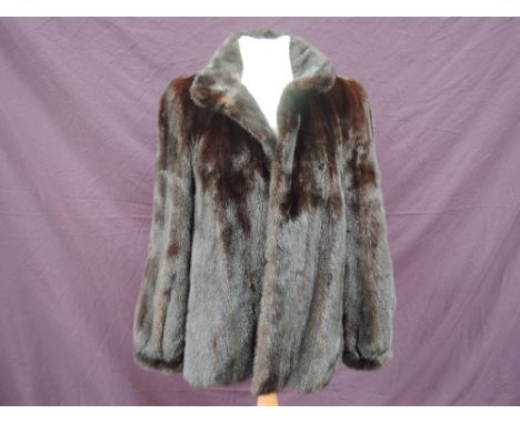 A lady's vintage dark brown mink evening jacket having stand up collar