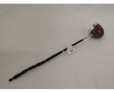 A Georgian toddy ladle having a treen bowl with white metal rim and mount to whalebone handle, no marks