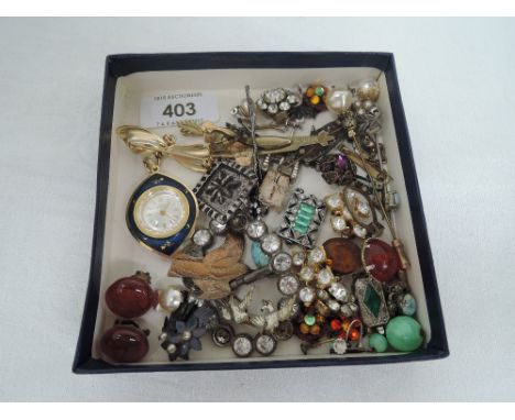 A small selection of vintage costume jewellery including earrings, hair slides, buckles, clasps etc