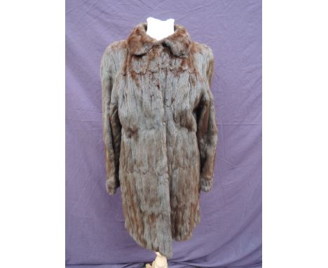 A vintage lady's brown mink 3/4 length coat having clip fasteners and round collar