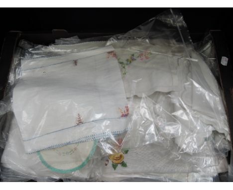A selection of vintage embroidered linen including tray cloths, runners, napkins, place mats etc