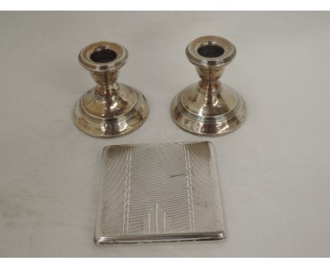 A silver cigarette case of square form having engine turned Art Deco style decoration, Birmingham 1931, Frederick Field, and 