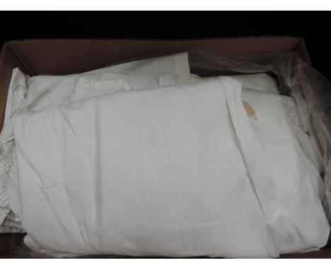 A selection of vintage linen including lace edged pillow cases, bolster cases, sheets, tablecloths, tray cloths, a gents line