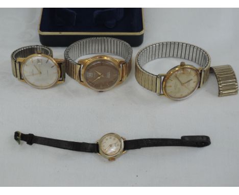 Three gents wrist watches including Tissot and a lady's wrist watch by Oris