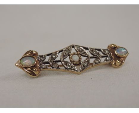 A 9ct gold bar brooch having opal and diamond chip decoration in an Art Deco style mount,  approx 4.5g