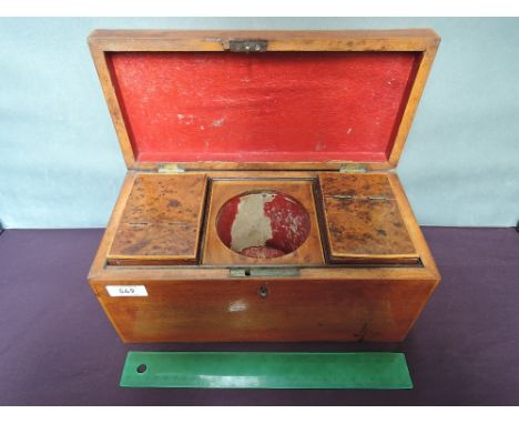 A 19th century mahogany tea caddy having burr fitted interior