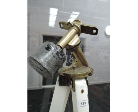 A vintage brass and white painted tripod/theodolite stand