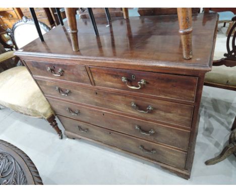 An early 19th century George III mahogany chest of two short and three long drawers on bracket feet