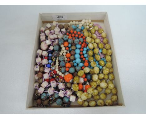 A small selection of vintage bead necklaces of various forms and colours