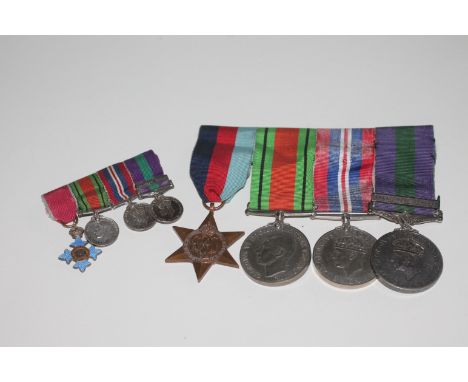 A SET OF FOUR MEDALS & ASSOCIATED MINIATURES. 1939 Star, Defence & War Medals, General Service Medal bar Palestine 1945-48. T