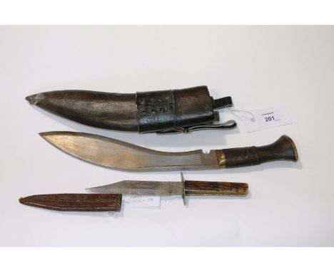 A KUKRI AND A ROVERS KNIFE. A young mans Kukri with 10" bladfe, complete with leather scabbard and knives. A J U James & Sons