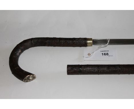 A JAPANESE SWORDSTICK. A Japanese swordstick with 19.1/4" blade, having a short fuller at the guard. In simulated cherry tree
