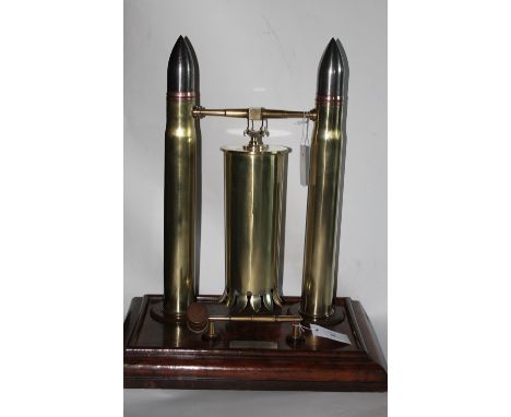 A 1916 HMS DUBLIN PRESENTATION DINNER GONG. A real quality 'Trench Art' period dinner gong, mounted on an oak plinth from the