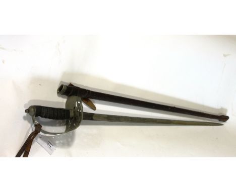 AN OFFICERS SWORD. A George V period 1897 pattern officers sword, with 32" blade that has been protected by a grease covering