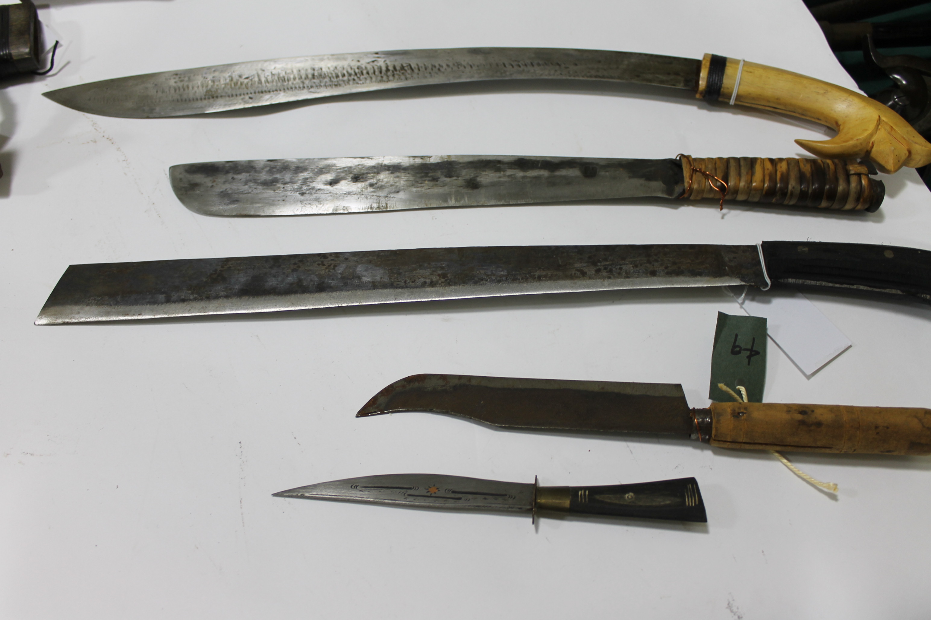 FIVE EASTERN KNIVES. Including a modern Bolo knife from the Philippines, with an 18" blade stampe
