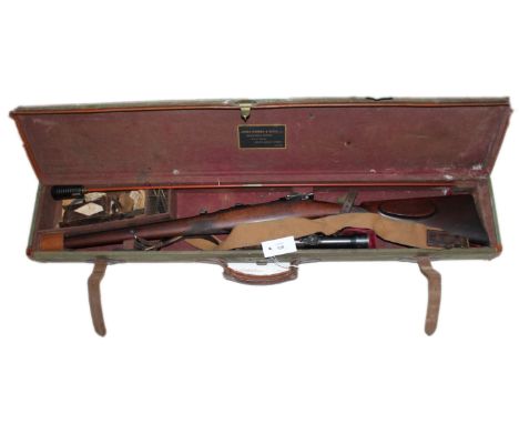 A 6.5mm MANNLICHER RIFLE WITH TELESCOPIC SIGHT. A short barrelled (17") number 21506, bolt action rifle with several bullet  