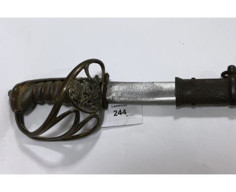 A GEORGE 1V SWORD & SCABBARD. A young mans lightweight sword with brass hilt with inset G1V device, complete with a steel sca