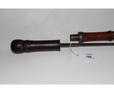 A GERMAN SWORDSTICK. A turn of the century swordstick with cane mounts, having a square form spike blade of 29" length marked