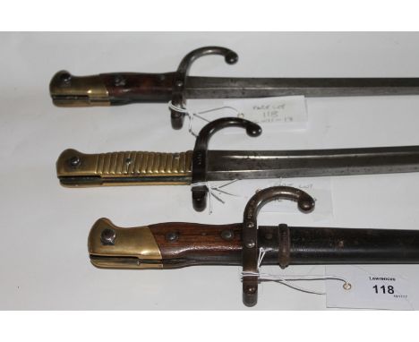 THREE FRENCH 19thC BAYONETS. An 1874 pattern Epee Bayonet complete with steel scabbard, the blade marked Steyr 1878. An 1866 