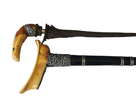 A 19thC JAVANESE IVORY & SILVER MOUNTED KRIS. An attractive 19thC Javanese Kris with both hilt and scabbard mouth, being of i