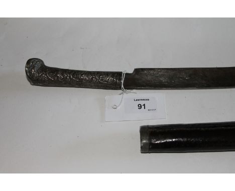 A YATAGAN SWORD. A Turkish Yatagan sword with silver hilt (damaged in places) the 22.1/2" blade with an arsenal or makers mar