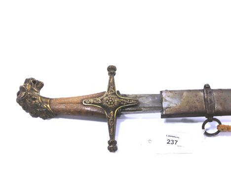 A 19thC SWORD & SCABBARD. An interesting 19thC sword with Lions Head pommel and cast brass crossguard. complete with its stee