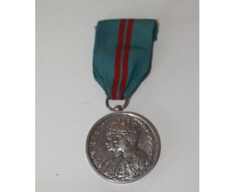 A DELHI DURBAR MEDAL 1911. An unnamed as issued Delhi Durbar Medal 1911, on original ribbon.  This medal was among the items 