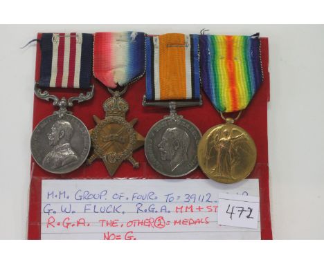 AN MILITARY MEDAL GROUP OF FOUR TO GNR FLUCK RGA. A GV Military Medal named to 39112 BMBR G W Fluck RGA. A 1914/15 Star named