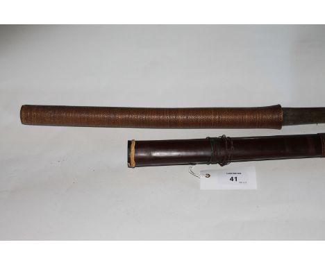 A 20thC DHA SWORD. A Dha sword from Thailand in the style favoured by the Burmese. Bound 14" hilt with a 26" blade. Contained