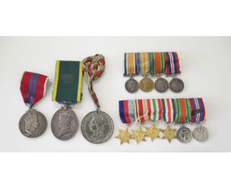 A TERRITORIAL EFFICIENCY MEDAL etc. A George V1 T E Medal named to 4389365 Cpl A Lawson R. North.D. Fus, with top bar Territo