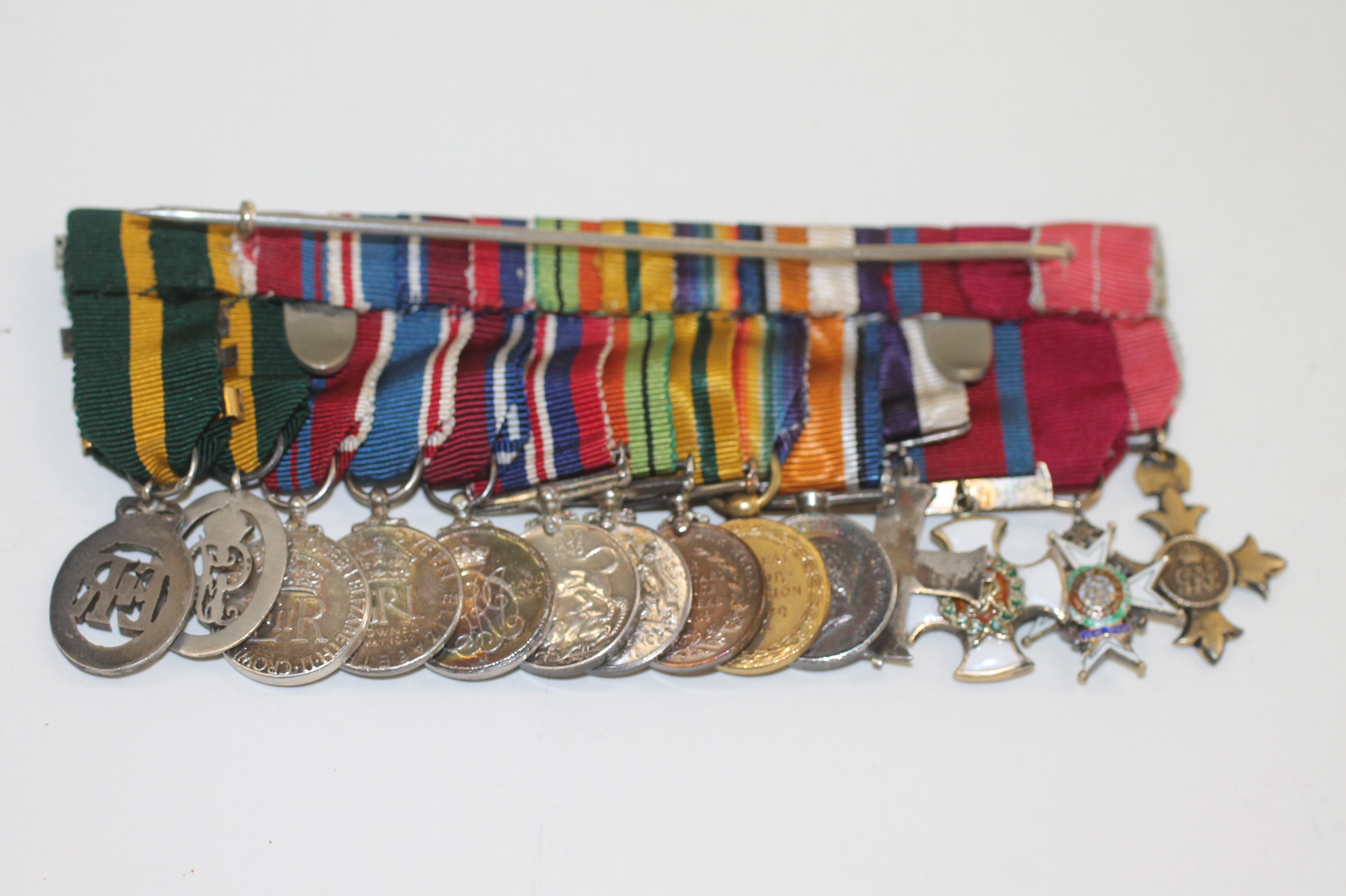 A GROUP OF MINIATURE MEDALS MOUNTED FOR WEAR (12) A CBE (Military)-CB ...