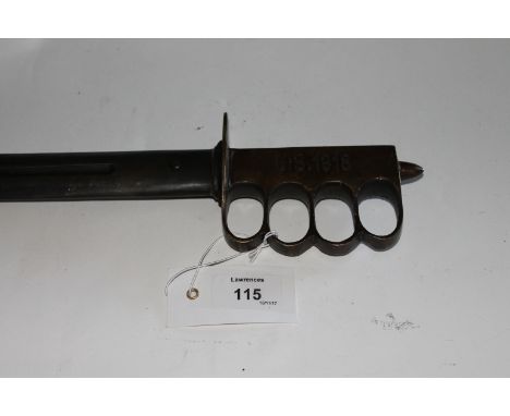 A US 1918 MARKED PATTERN KNUCKLEDUSTER DAGGER Brass hilt stamped US 1918 and a double-edged 12.5/8" blade with narrow central