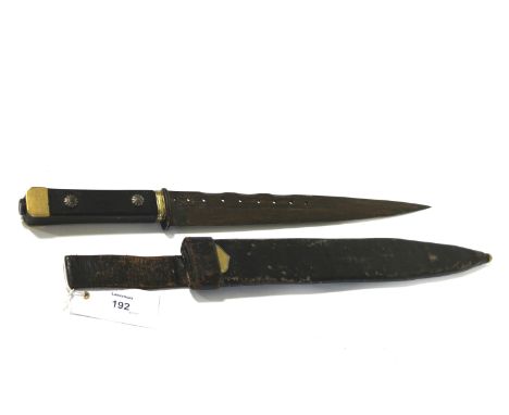A DAGGER & SCABBARD. A single-edged dagger with 11.3/4" blade, having two narrow fullers per side and nine piercing's. In the