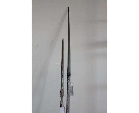 TWO METAL LANCES. Two steel lances from the middle or far east, with square blades and round shafts. 63.1/2" and 75" respecti