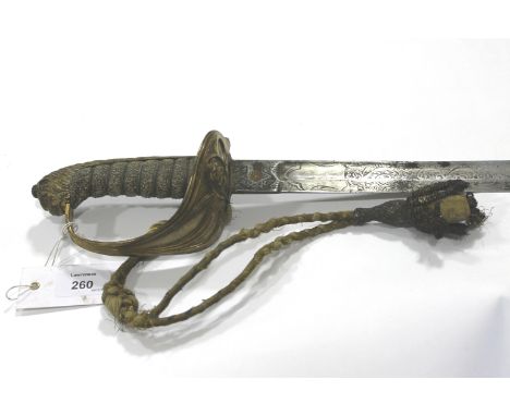 A ROYAL NAVY OFFICERS SWORD . A Victorian Royal Navy officers sword with a folding guard and old sword knot attached. The bla