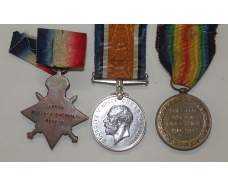 A BEDFORDSHIRE REGT TRIO. A 1914/15 Star, British war & Victory Medals named to 17683 Pte W J Theobald Bedford R. Walter J Th