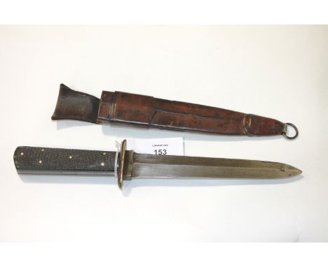 A FIGHTING KNIFE & SCABBARD. A spearpoint double-edged fighting knife, with a 7.1/2" blade marked B Luscombe & Co, (?) illama