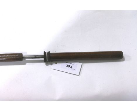 A SWAGGER/SWORD STICK. An officers swaggerstick with 11.1/2" circular tapering spike blade, in a wooden mount.