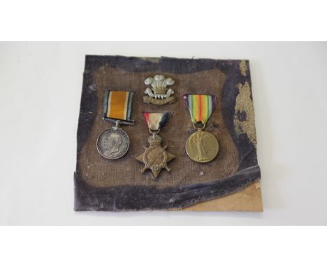 A 1914/15 TRIO TO THE WELSH REGT. A 1914/15 Star also British War and Victory Medals, named to 31338 Pte W Thomas Welsh R. Wi