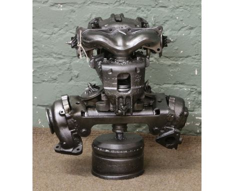 An industrial abstract sculpture of a robot.