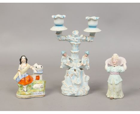 A coloured bisque figural nodding twin branch candelabra, similar nodding figure and a Victorian Staffordshire figure of a gi